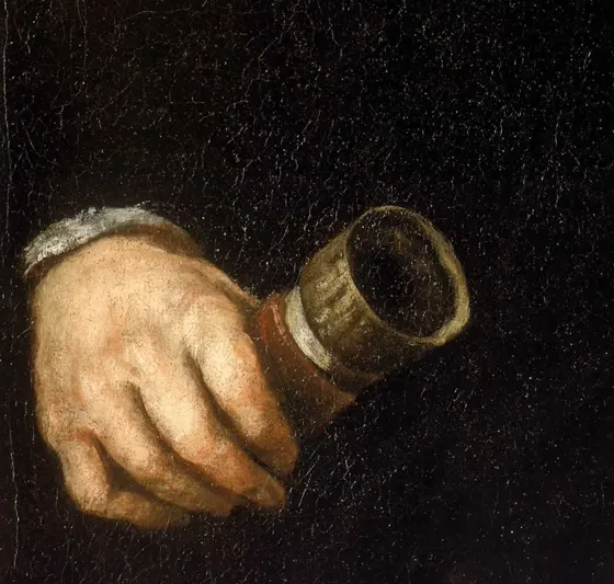 Galileo's hand holding a telescope